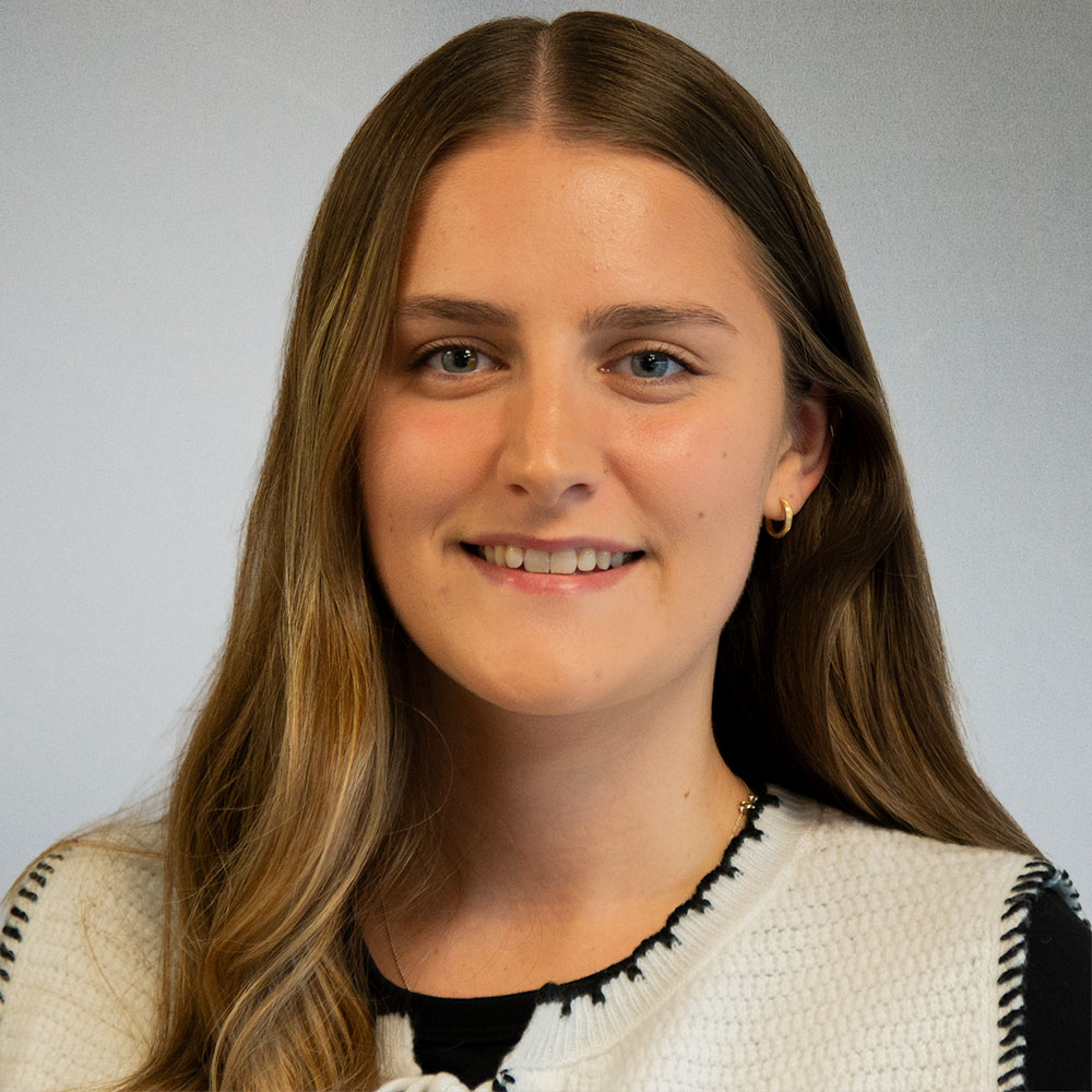 Trainee solicitor Molly Harvey smiling in a professional headshot at Flint Bishop.
