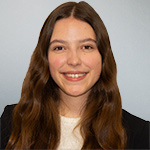 Lois Coleshill, Trainee Solicitor at Flint Bishop, professional headshot on plain background.